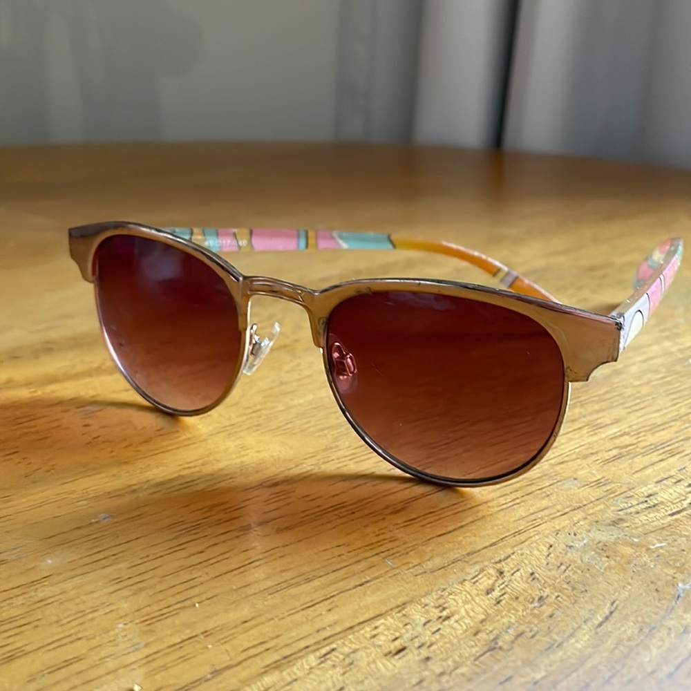 Sunglasses with club master style frames and art deco detailing